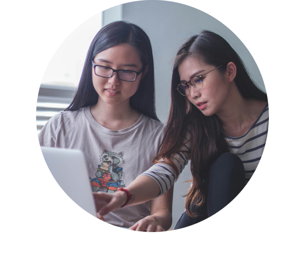 Two girls using a laptop